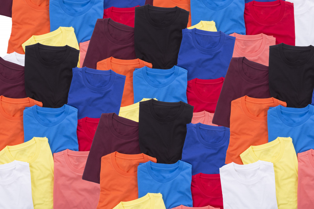 Colorful t-shirts folded as background