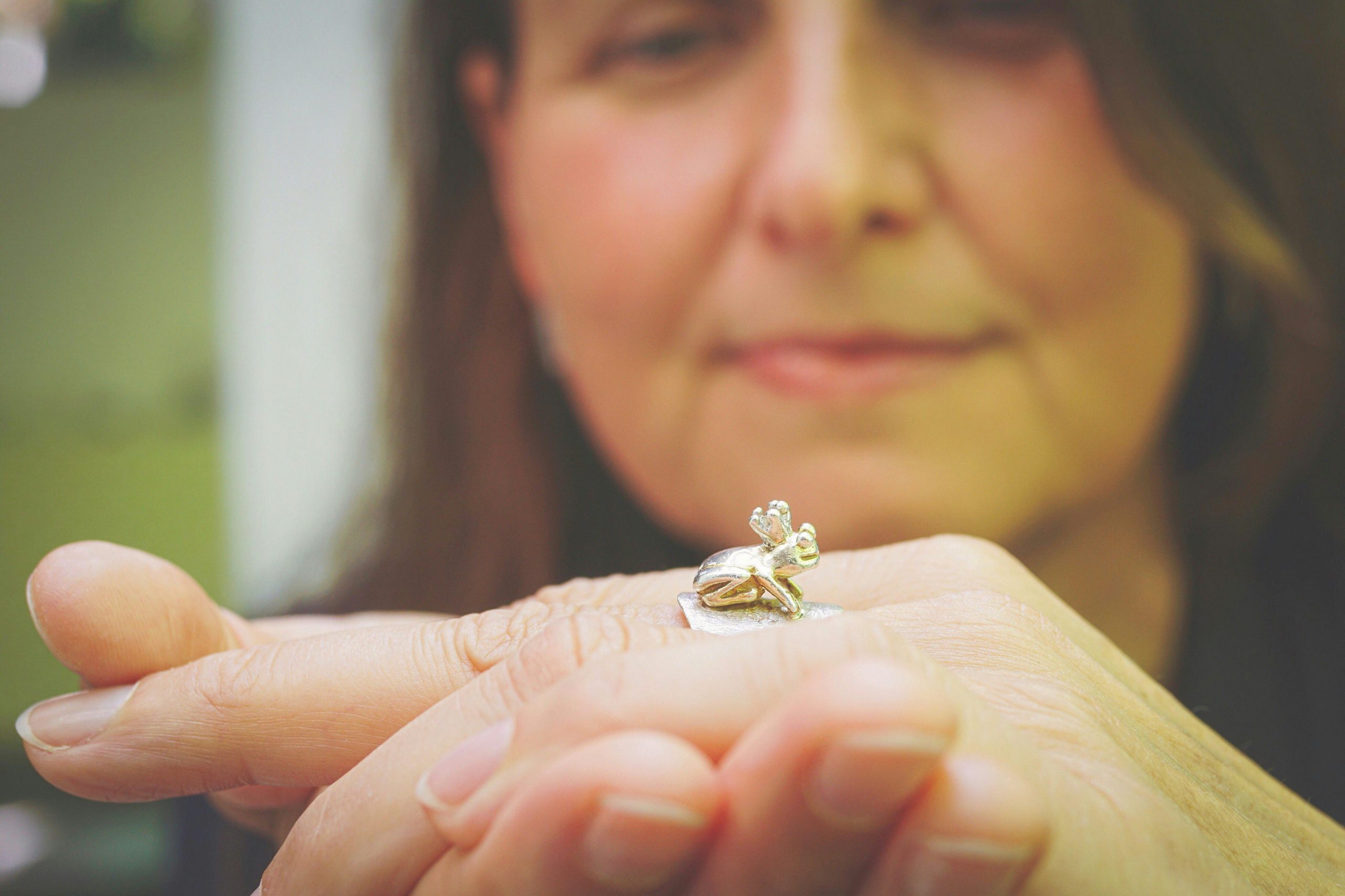 close-up of a middle-aged woman's hand wearing a ring